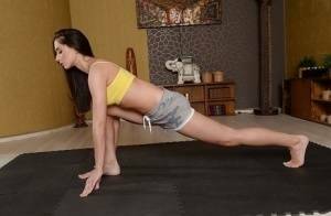 Cute brunette babe Aruna Aghora doing yoga in shorts and bare feet on justmyfans.pics