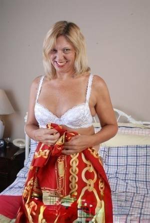 Older blonde lady removes hot white lingerie set for cunt masturbation on justmyfans.pics