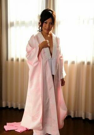 Japanese solo girl slips off her robe to reveal her nice boobs in white socks - Japan on justmyfans.pics
