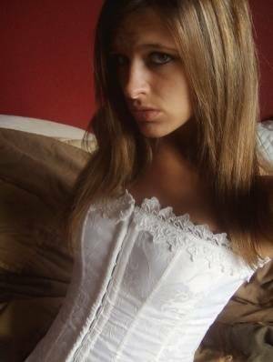 Teen in white corset and tight panties showing off her perfect tight body on justmyfans.pics
