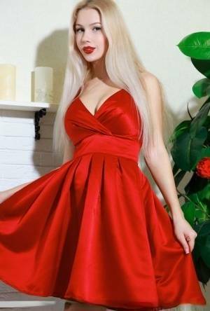 Nice blonde teen Genevieve Gandi removes red dress to display her trimmed muff on justmyfans.pics