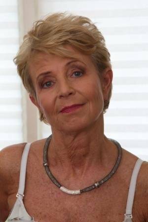 Blonde granny sports short hair while masturbating with a vibrator on justmyfans.pics