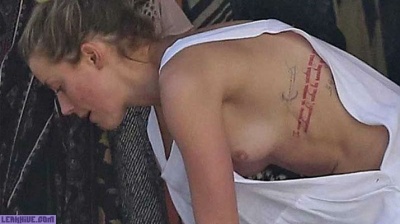 Amber Heard caught topless on the beach - leakhive.com
