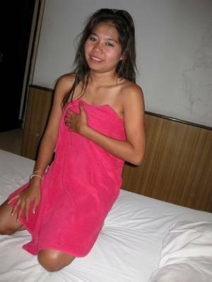 Petite Thai girl washes up her shaved pussy after bareback sex with a tourist - Thailand on justmyfans.pics