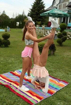 Young lesbians Eveline Dellai & Katy Rose fist pussies during sex on a lawn on justmyfans.pics
