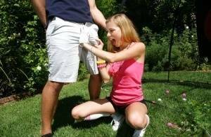 Young blonde girl Nicole Ray giving large dick oral sex outdoors on lawn on justmyfans.pics