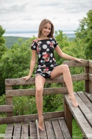 Barefoot teen Linda A gets totally naked at a lookout spot in the woods on justmyfans.pics